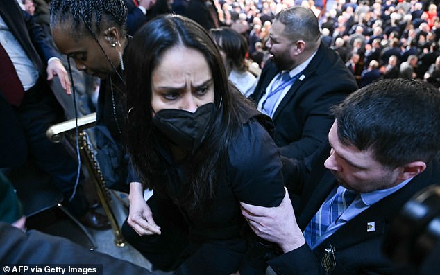 Aliya Rahman, 43, is seen being taken into custody by Capitol Police