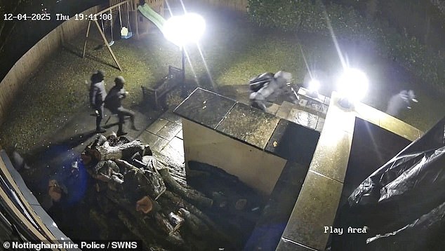 The masked gang were dressed in all black and armed with a sledgehammer and pickaxe