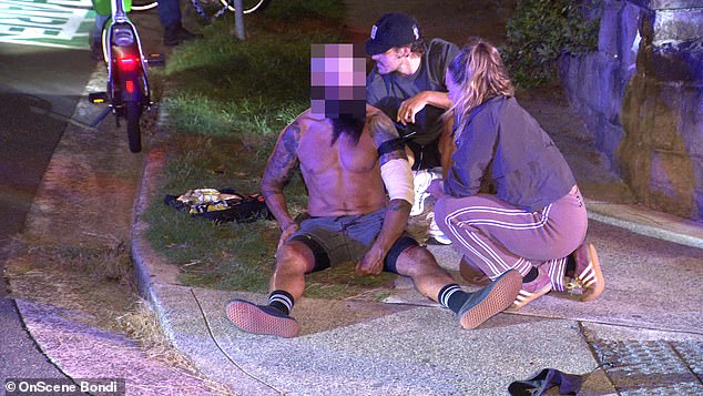 Bondi Beach is rocked by 'random' stabbing attack: Victim is rushed to hospital after being 'knifed in the back'