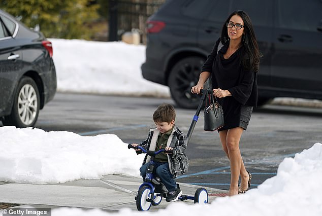 Rep. Lauren Boebert (R-CO) with her grandson Josiah Boebert returns for the continuation of testimony of former U.S. Secretary of State Hillary Clinton