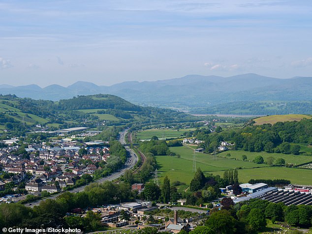 But the enormous structure, in the village of Mochdre (pictured, file photo), north Wales, has never been used as the local authority later discovered the floor was too weak to support the heavy goods vehicles