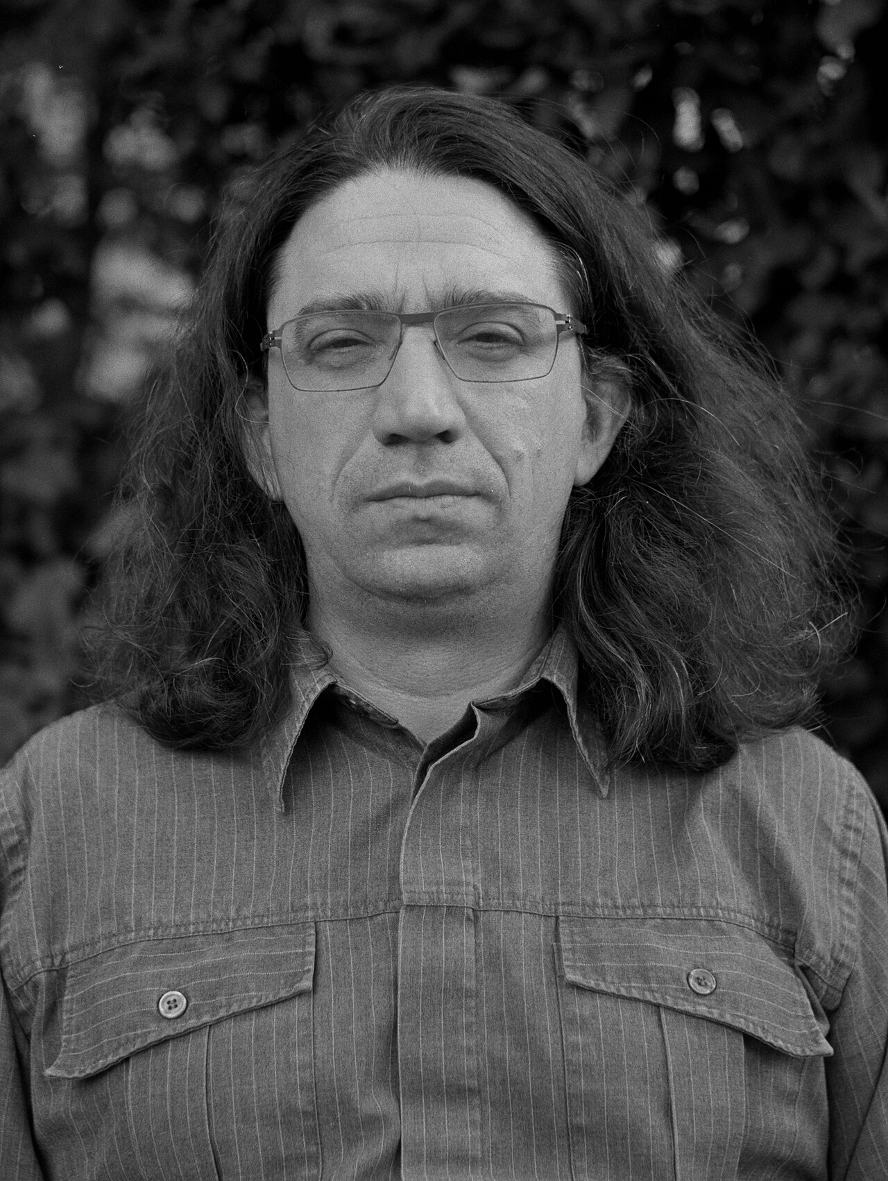 Black-and-white head shot of Yarvin facing the camera