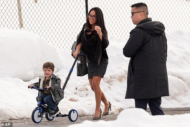 Rep. Lauren Boebert, R-Colo. arrives back at the Chappaqua Performing Arts Center with her grandson, Josiah Boebert, during a deposition by Secretary of State Hillary Clinton who was testifying before U.S. House lawmakers as part of a congressional investigation into convicted sex offender Jeffrey Epstein, Thursday