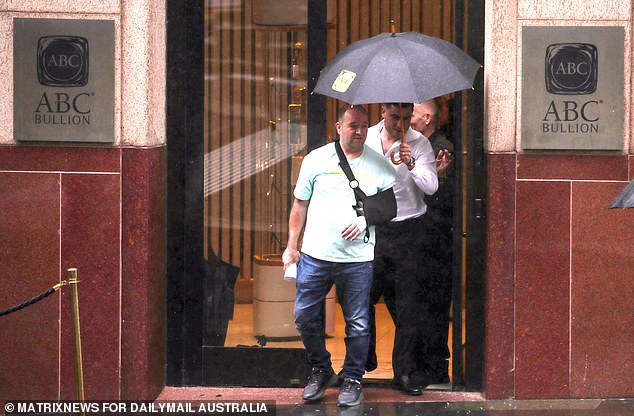 Bondi massacre hero Ahmed al-Ahmed is laughing all the way to the bank as he ploughs his millions into GOLD - and gets a rock star welcome in Sydney's financial centre