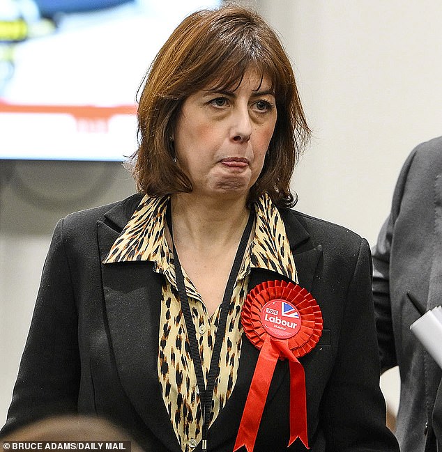 A glum-looking Labour deputy leader Lucy Powell is pictured watching on as votes are counted in the Gorton and Denton by-election