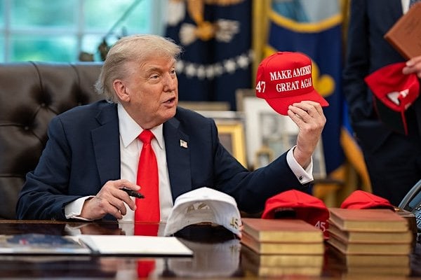 President Donald Trump exchanges gifts with German Chancellor Friedrich Merz, Thursday, June 5, 2025, in the Oval Office. (Official White House photo by Daniel Torok)