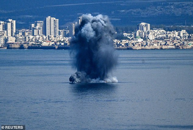 An explosion is seen off the coast of Haifa in northern Israel on Saturday as Iran retaliated against a joint US-Israel operation that took place Saturday morning
