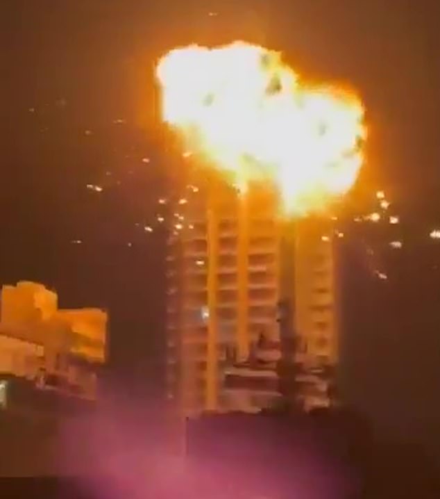 A fireball explosion erupts from a building in Manama, Bahrain, after an Iranian drone attack