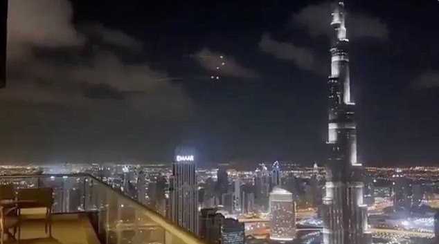 A cluster of missiles sailing over Dubai overnight - some of the more than 100 launched by Iran at the state