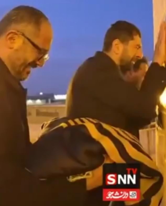 Flag replacers at the Imam Reza shrine, the third largest mosque in the world, were seen crying on live television as Khamenei's death was announced
