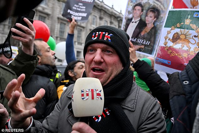 Demonstrators, who were joined by far-right activist Stephen Yaxley-Lennon (pictured, at the rally), also known as Tommy Robinson, gathered outside the Ministry of Defence in central London ahead of a march down to the Iranian embassy