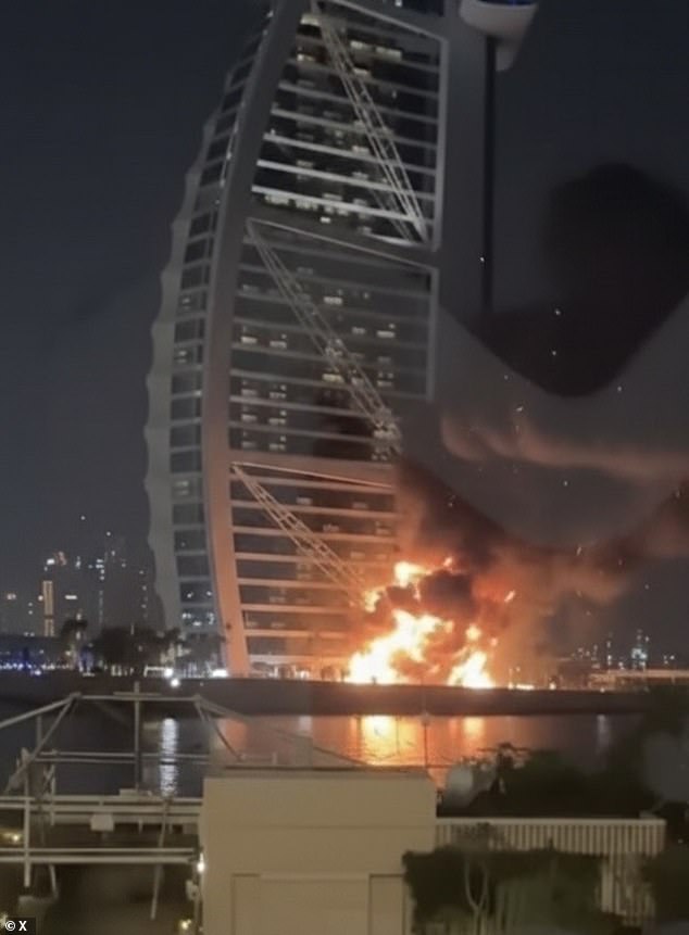 Footage shows the Burj Al-Arab hotel ablaze after being hit by a suspected Shahed suicide drone launched from Iran hours after US and Israeli air strikes hit Tehran