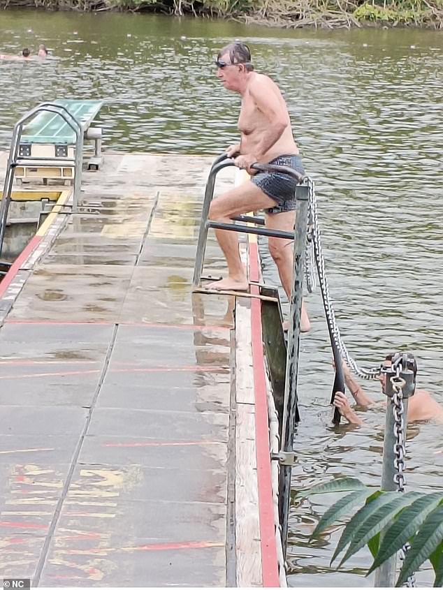 The sacked ambassador to the US is pictured sporting a pair of dark goggles and some tight grey shorts for the spot of exercise