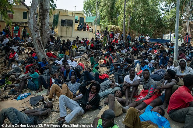 Dozens of migrants are pictured in the Ceuta Temporary Immigrant Stay Centre (CETI), which  is experiencing extreme tension and severe overcrowding