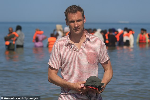 Shadow home secretary Chris Philp has called for a binding annual cap on inward immigration and a tightening of visa rules. Mr Philp pictured in France, where migrants attempted to cross the English Channel