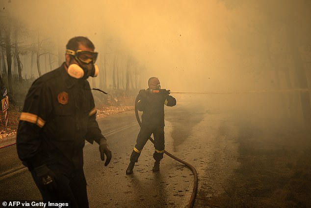 Authorities said strong winds made the fire spread more quickly and made it unpredictable. Emergency crew are seen tackling the blaze here