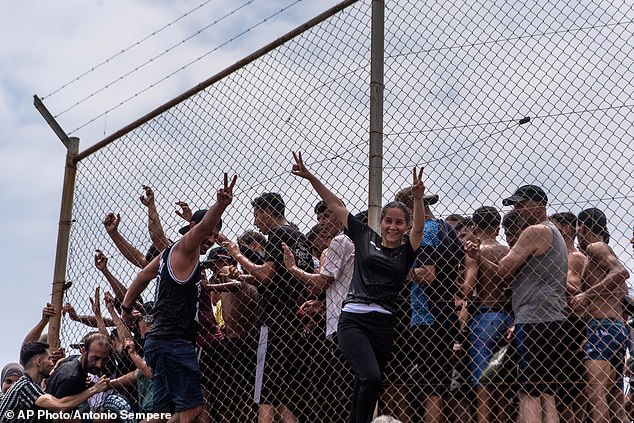 Migrants cross from Morocco into the Spanish enclave of Ceuta, Thursday, July 30, 2026