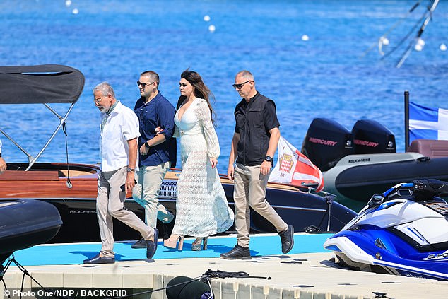 Her sky-high platforms may have been red carpet-ready, but they proved rather less practical on the floating dock, where uneven footing and rocking boats can challenge even the most seasoned stiletto wearer