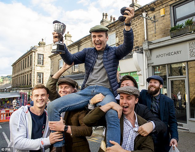 The quirky northern tradition is said to have been inspired by a bitter 1455 battle in nearby Stubbins during the War of the Roses (Pictured: PTom Lowten celebrating his win in 2019)
