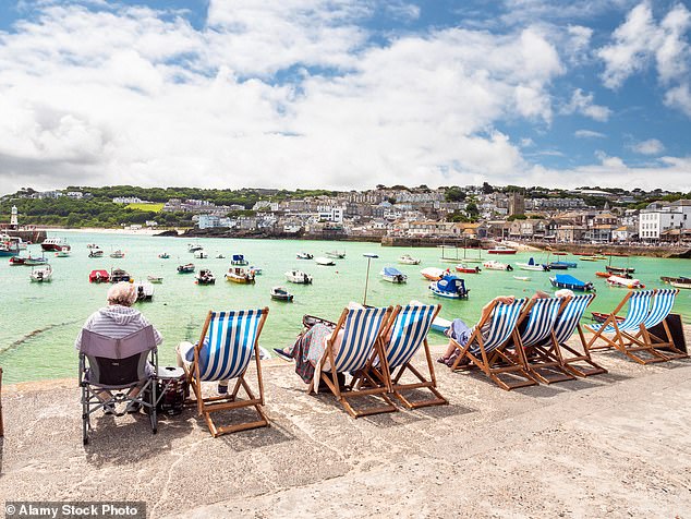 St Ives (pictured) has about 10,000 permanent residents but 760,000 annual visitors