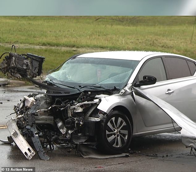 A black Ford Bronco and a silver sedan were involved in the collision. The sedan's front was left crushed afterward