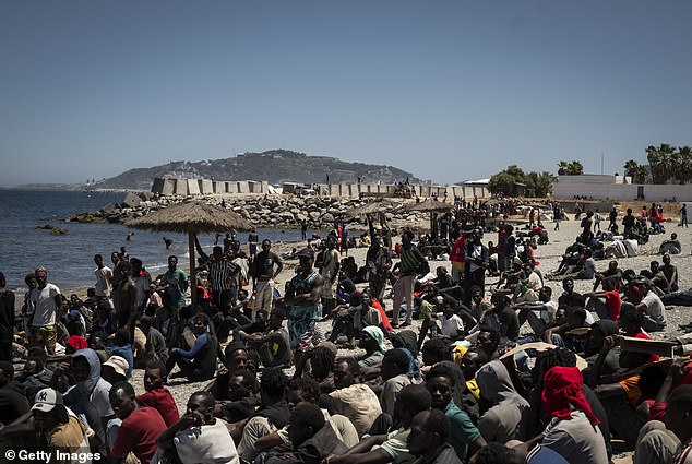 An estimated 50,000 people crossed from Morocco into Ceuta on Thursday (pictured)