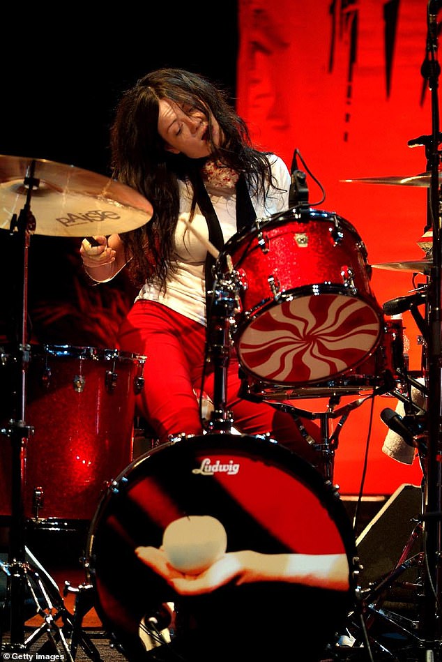 Meg is seen playing the drums at a concert in London in 2005. Many critics dismissed her skills as 'primitive,' but her musical abilities were later lauded as well ahead of their time