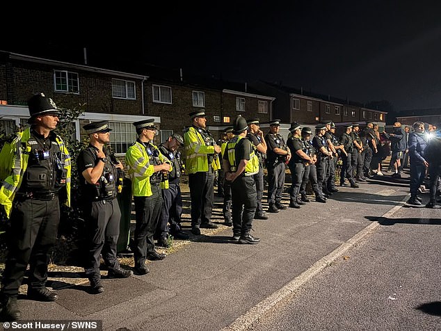 Two officers were injured last night - one hit by a rock, the other bitten