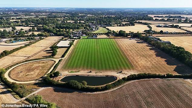 Aerial view of dry grass surrounding the King Power Polo pitch in Holyport, Berkshire