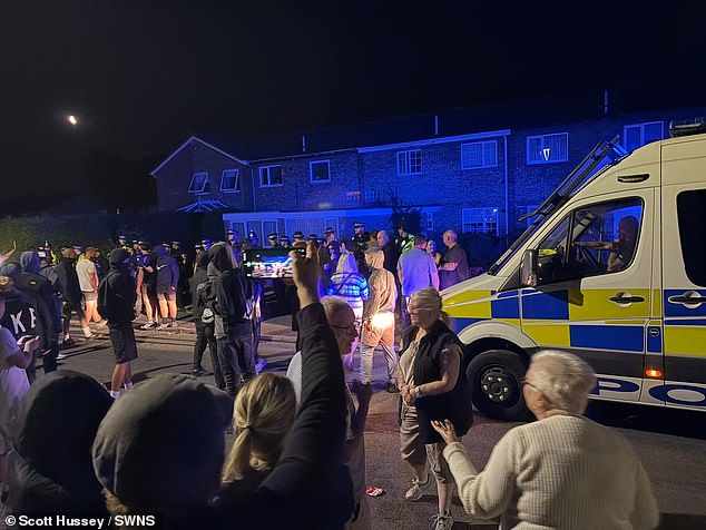 Police attend a second night of protests, this time in Clover Way