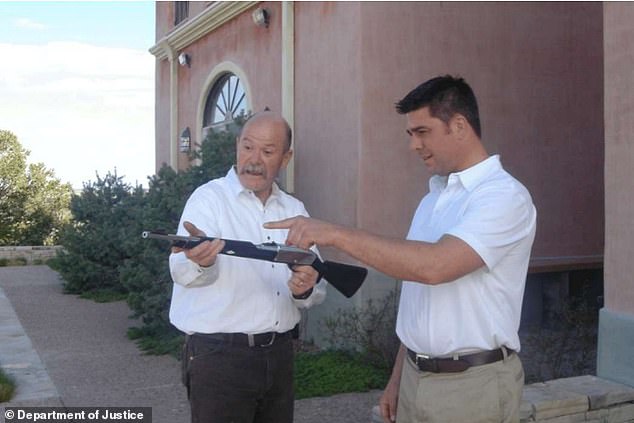 New Zealand-born couple Brice and Karen Gordon, who were entrusted with managing Epstein's ranch for years, are among the few employees name-checked in the report. Brice is pictured showing an unnamed guest at the ranch the barrel of the gun