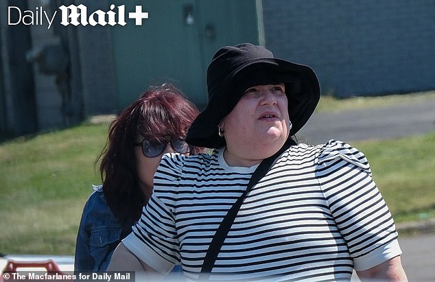 Mysterious mansion covered in spiders and skeletons is talk of ritzy suburb. Now its owner is revealed as reclusive female music megastar pictured for first time in 17 YEARS... see her secret new life