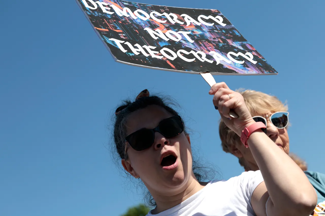  A protester carries a sign as they attend the "Jewish Rally for Abortion Justice" rally at Union Square near the U.S. Capitol on May 17, 2022 in Washington, DC. (Photo by Anna Moneymaker/Getty Images)