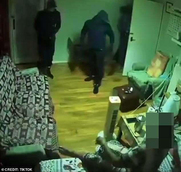 Moment masked thieves break into elderly woman's home and order her to stay silent during burglary - before taking off with cash and jewellery