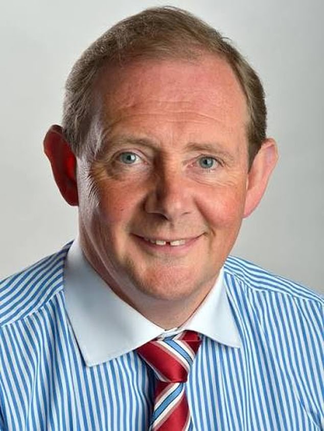 Professor George Holmes (pictured) was fired after two decades at the head of the university