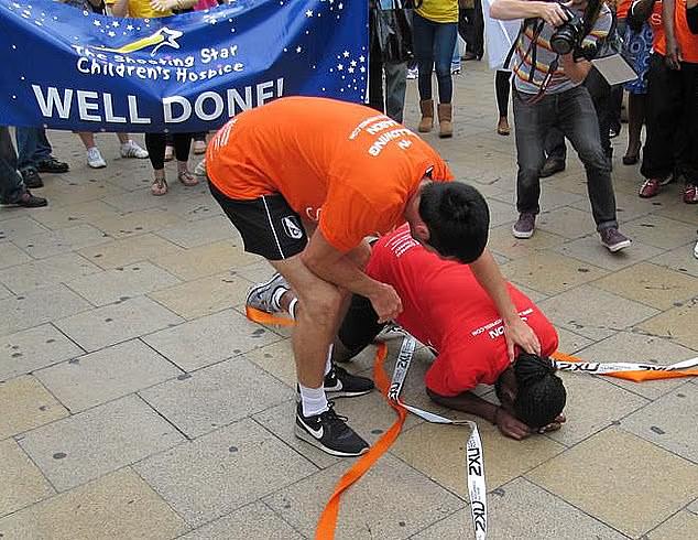 Arday pictured at the finish line of the marathon. He was photographed at Piccadilly Circus with two regular-sized legs despite claims to the contrary