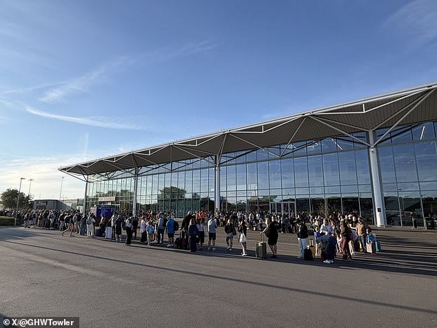Passengers queuing outside Bristol Airport. Many flights were cancelled or diverted hundreds of miles away