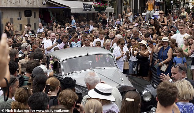 A vintage grey Rolls Royce arrived in the square to drop the bride off for the ceremony after earlier setting off from the nearby Savoy Palace hotel