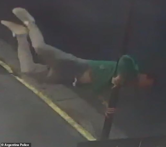 Liam is seen swinging around a pole in the street at 3am as he waited for drugs to be delivered - leading investigators to conclude he may have had the upper-body strength to believe he could safely climb down from his hotel room balcony