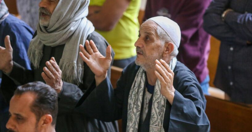 Coptic Christians in worship at a Palm Sunday service in Cairo, Egypt on April 5, 2026.