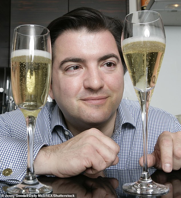 Matthew looks closely as he Tests Marks & Spencer's new Champagne glass for the Daily Mail
