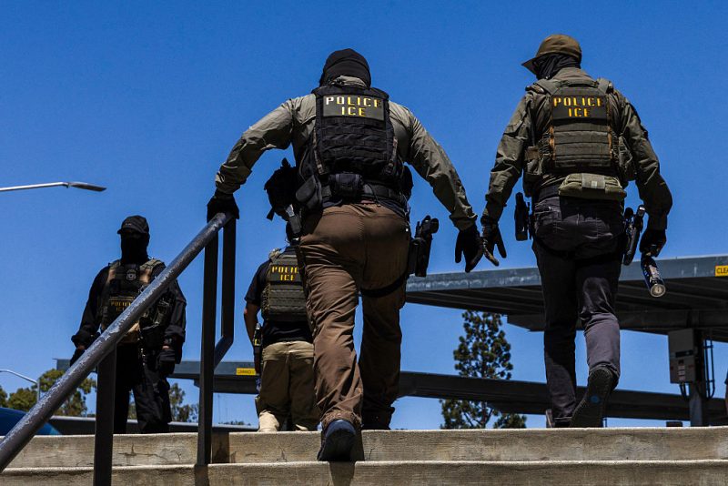 Immigration and Customs Enforcement (ICE) agents walk outside the Ventura County Government Center in Ventura, California, on July 27, 2026. (Photo by Blake Fagan / AFP via Getty Images)