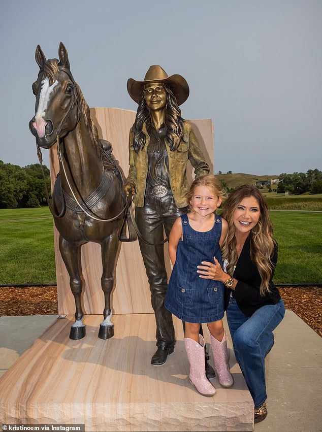 Kristi Noem's cross-dressing husband Bryon is nowhere in sight as family celebrates bronze statue unveiling, days after she was seen getting cozy with Corey Lewandowski