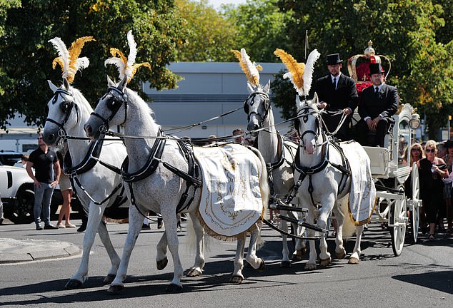A horse and cart were also present for the procession where Mr Hanrahan's body was carried through the streets of west London
