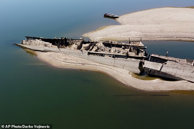 The wreckage of a Nazi warship in front of Djerdap II, a large dam on the Danube between Romania and Serbia
