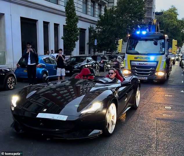 Perks of the job: One lucky police officer drove the limited edition Ferrari Monza SP2 around Mayfair