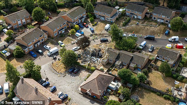 Moment bungalow explodes in massive 'gas explosion' with bricks and debris flying everywhere - as man is injured and homes evacuated