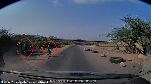 Armed police on the roadside as Mr Wright unknowingly missed a mandatory customs turn-off