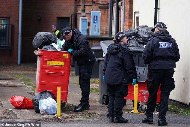 Police searching bins after the attack in February. Harper Dennis, 18, of North Road in West Drayton, London, denies murder