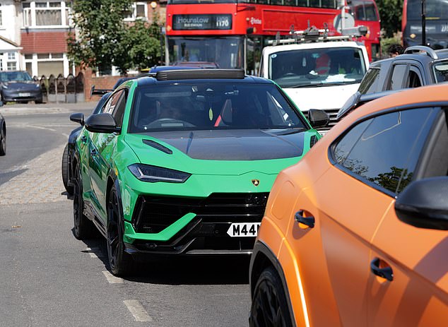A fleet of silver Rolls Royce's and Lamborghini super cars brought the high street to a standstill in Hayes